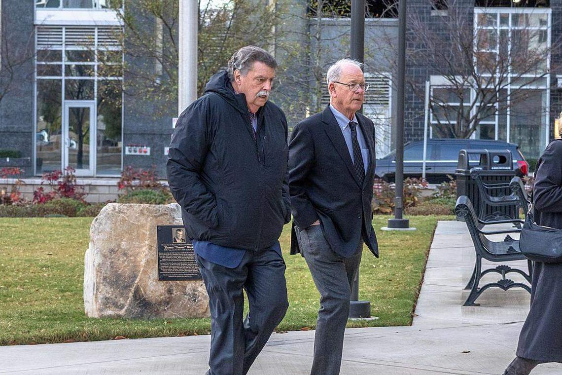 CHARLOTTE, NORTH CAROLINA - DECEMBER 1: Mike Helton, NASCAR Vice Chairman (left) and Jim France, NASCAR Chairman and CEO (right), arrive for trial at the Charles R Jonas Federal Building on December 1, 2025 in Charlotte, North Carolina. Jury selection and opening statements are set to begin in an antitrust lawsuit filed by Michael Jordan's 23XI Racing team against NASCAR. (Photo by Grant Baldwin/Getty Images)