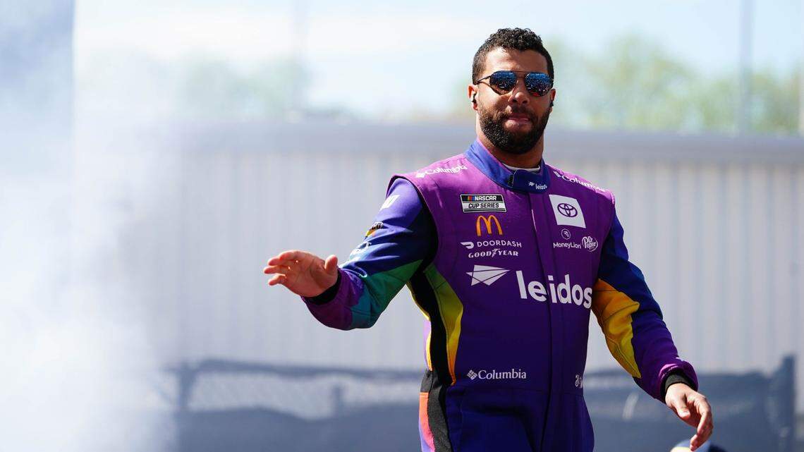 Apr 2, 2023; Richmond, Virginia, USA; Bubba Wallace waves to fans before the race during the Toyota Owners 400 at Richmond Raceway. Mandatory Credit: John David Mercer-USA TODAY Sports