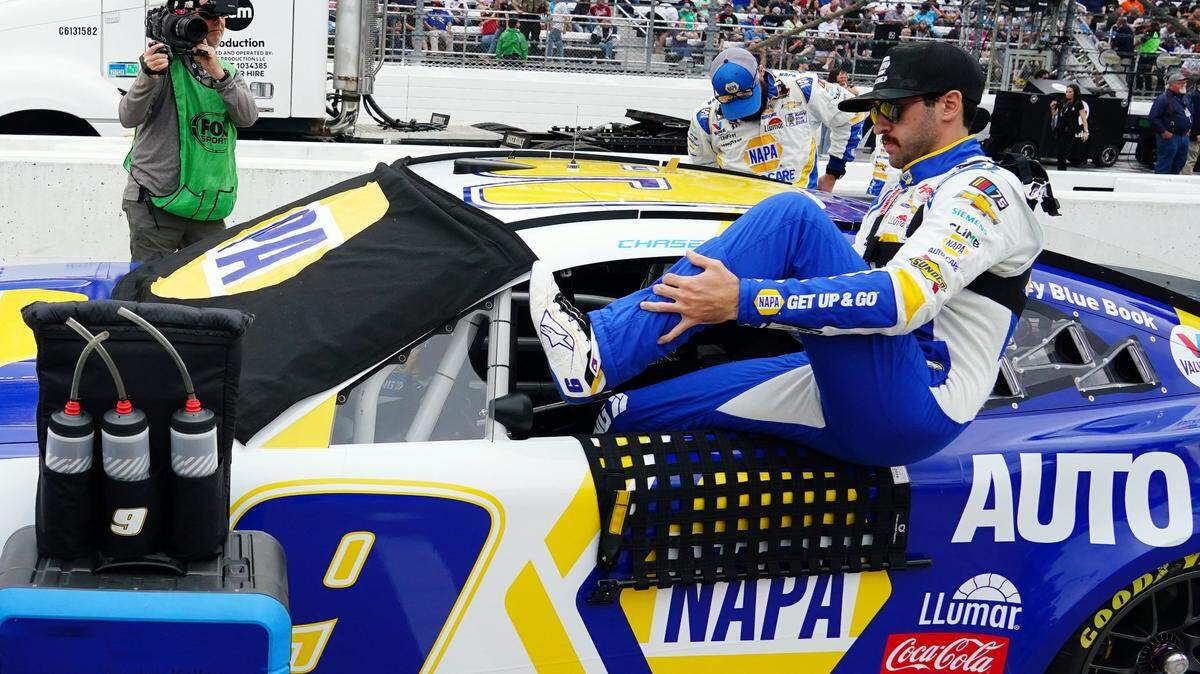 Apr 16, 2023; Martinsville, Virginia, USA; NASCAR Cup Series driver Chase Elliott (9) climbs into his car before the NOCO 400 at Martinsville Speedway. Mandatory Credit: John David Mercer-USA TODAY Sports