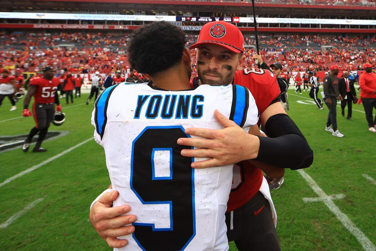 TAMPA, FLORIDA - DECEMBER 29: Baker Mayfield #6 of the Tampa Bay Buccaneers hugs Bryce Young #9 of the Carolina Panthers after the game at Raymond James Stadium on December 29, 2024 in Tampa, Florida. (Photo by Mike Ehrmann/Getty Images)