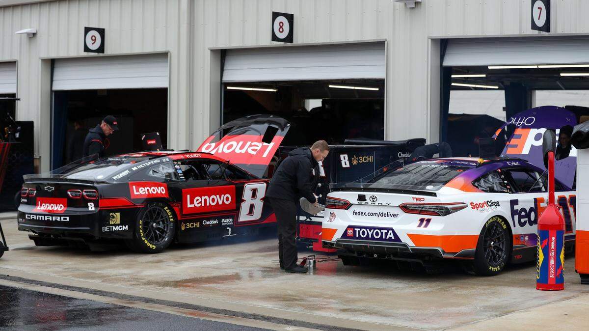 Apr 29, 2023; Dover, Delaware, USA; The cars of NASCAR Cup Series driver Kyle Busch (8) and driver Denny Hamlin (11) sit in the garage during practice and qualifying for the Wurth 400 at Dover Motor Speedway. Mandatory Credit: Matthew OHaren-USA TODAY Sports