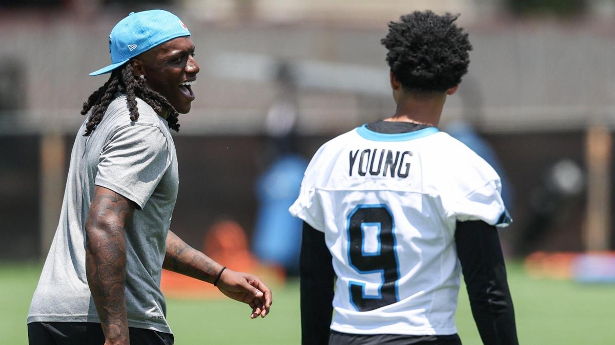 Panthers cornerback Jaycee Horn, left, laughs in response as he and quarterback Bryce Young have a playful exchange during the second day of minicamp in Charlotte, NC on Wednesday, June 11, 2025.