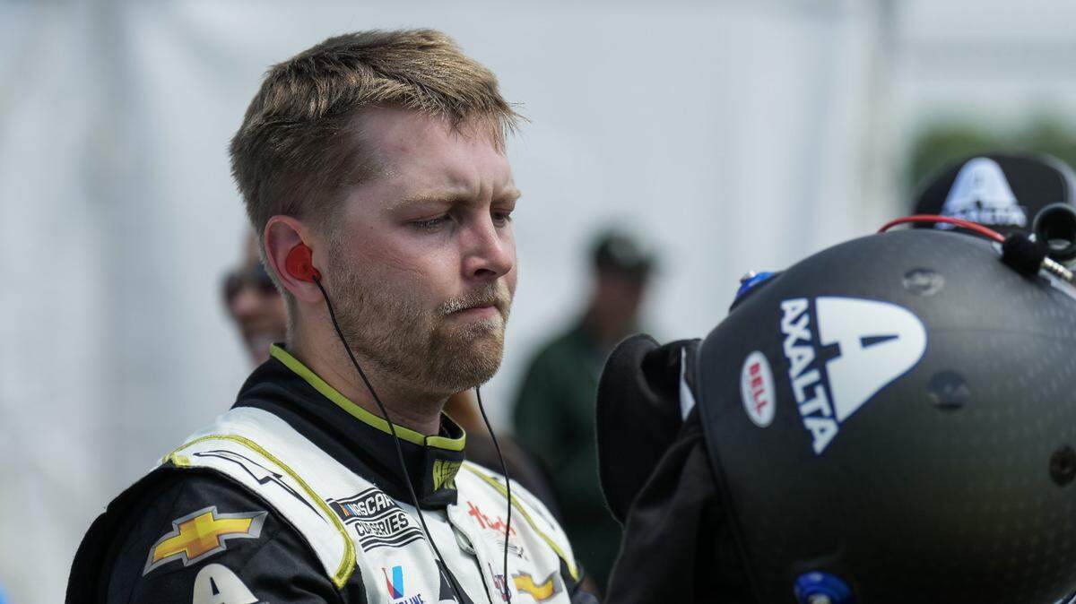 May 13, 2023; Darlington, South Carolina, USA; William Byron exits his car after a qualifying lap at Darlington Raceway. Mandatory Credit: David Yeazell-USA TODAY Sports