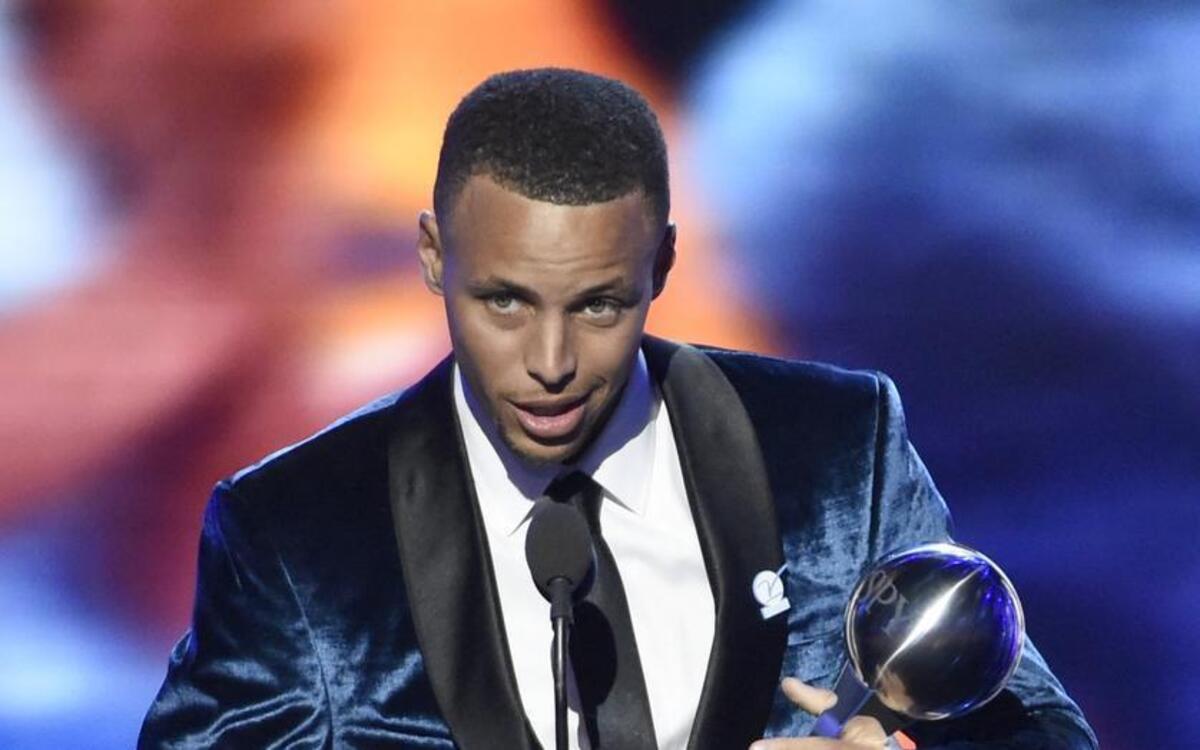NBA basketball player Stephen Curry, of the Golden State Warriors, accepts the award for best record-breaking performance at the ESPY Awards at the Microsoft Theater on Wednesday, July 13, 2016, in Los Angeles.