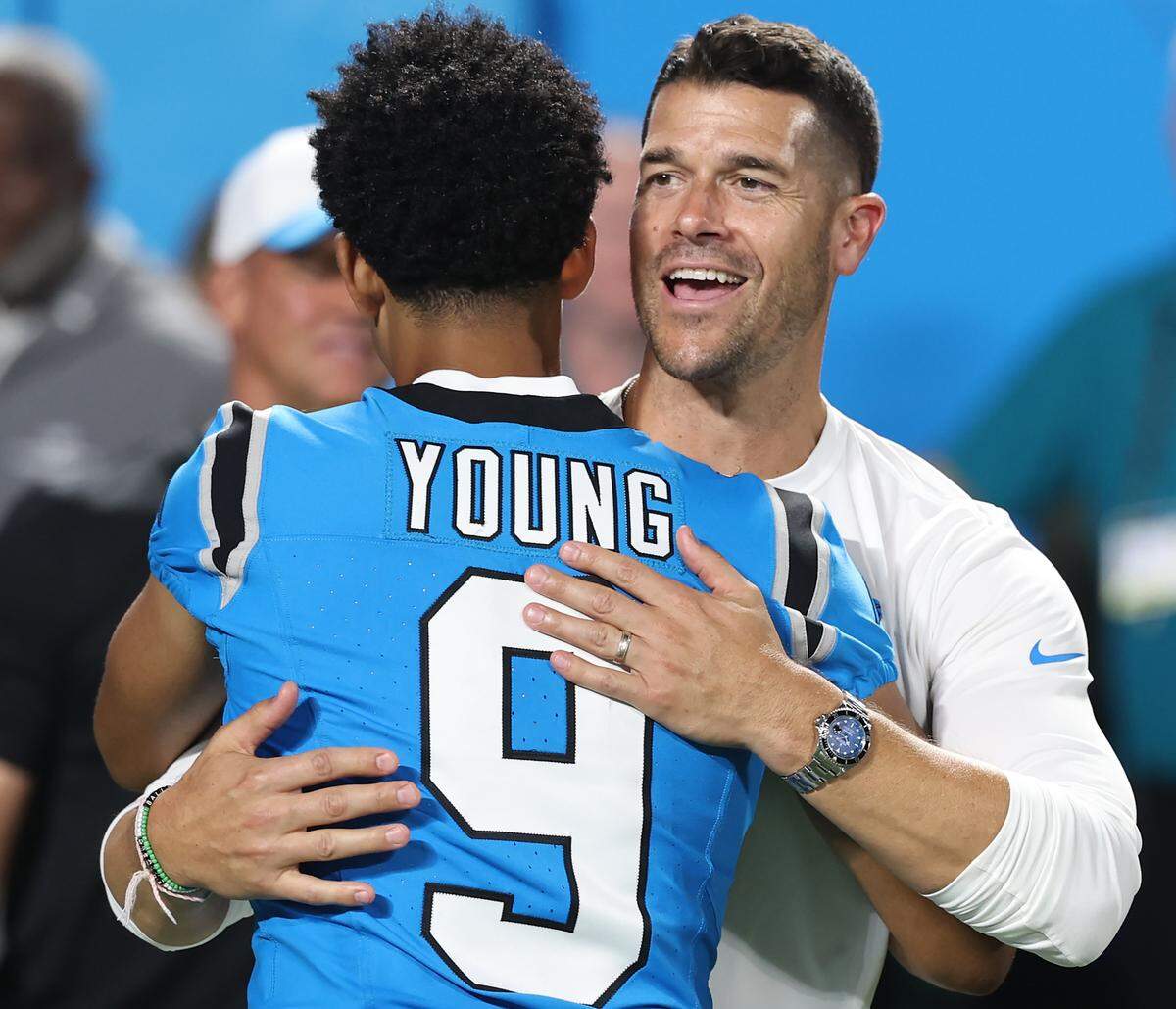 Carolina Panthers quarterback Bryce Young, left, receives a hug from head coach Dave Canales, right, following the team’s game against the Cleveland Browns on Aug. 8, 2025, at Bank of America Stadium. The Browns defeated the Panthers 30-10.