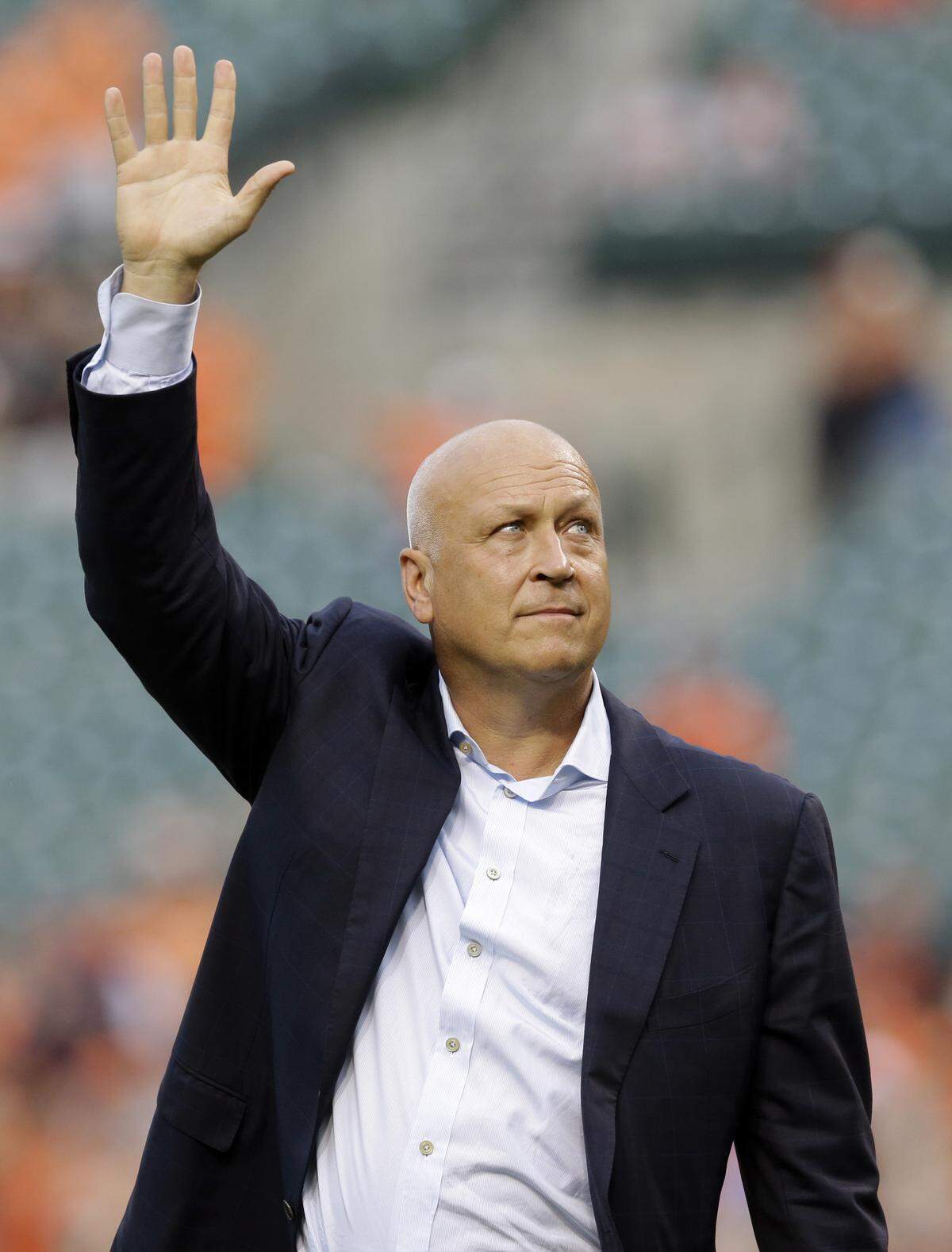 Former Baltimore Oriole Cal Ripken, Jr., acknowledges fans before throwing out the ceremonial first pitch to mark the twentieth anniversary of his streak of 2,131 straight games before a baseball game between the Orioles and the Tampa Bay Rays, Tuesday, Sept. 1, 2015, in Baltimore. (AP Photo/Patrick Semansky)