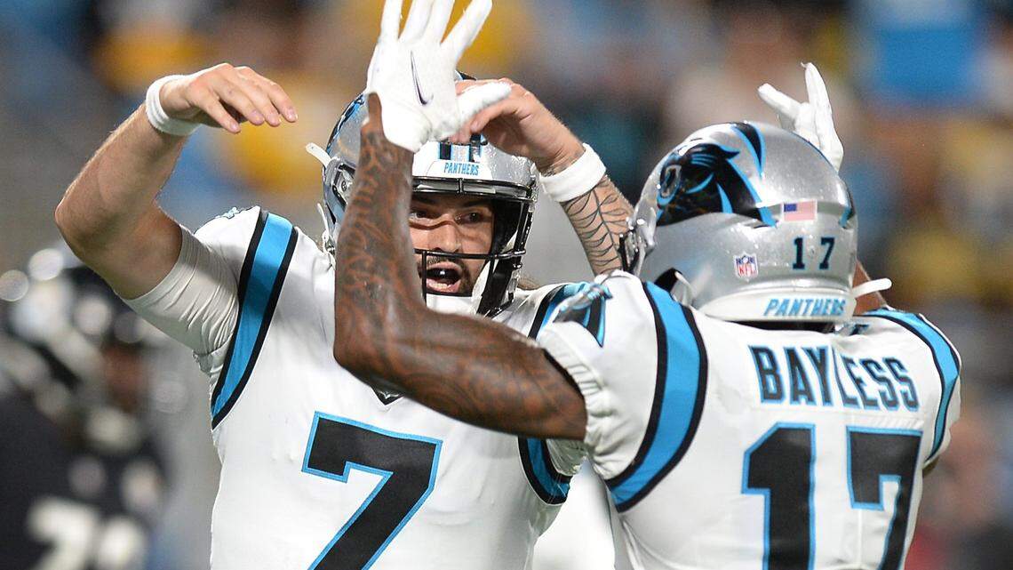Carolina Panthers quarterback Will Grier, left and wide receiver Omar Bayless, right, celebrate Grier’s touchdown run against the Pittsburgh Steelers during fourth quarter action at Bank of America Stadium in Charlotte, N.C., on Friday, August 27, 2021.