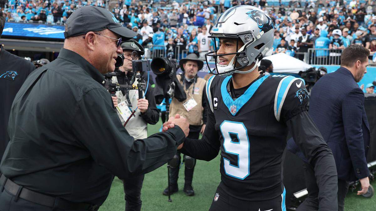 Carolina Panthers team owner David Tepper, left and quarterback Bryce Young, right, greet one another prior to the team’s game against the Los Angeles Rams at Bank of America Stadium on Saturday, January 10, 2026. The Rams defeated the Panthers 34-31.