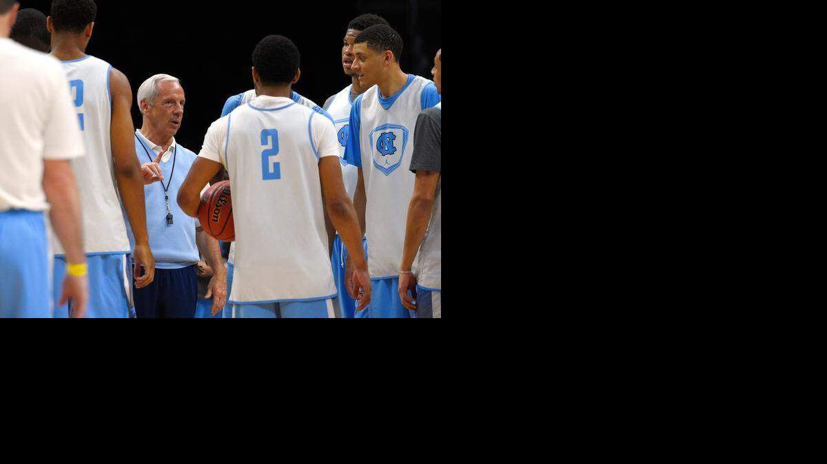 
North Carolina coach Roy Williams talks to his players during practice Wednesday, March 25, 2015, in Los Angeles, for a regional semifinal against Wisconsin in the NCAA men's college basketball tournament. 
