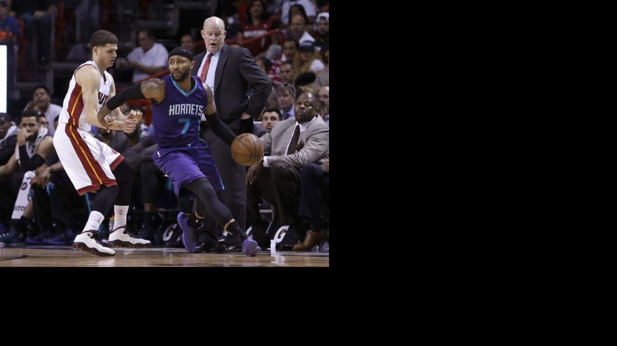 
Charlotte Hornets guard Mo Williams (7) drives around Miami Heat guard Tyler Johnson (8) Tuesday in Miami. 

