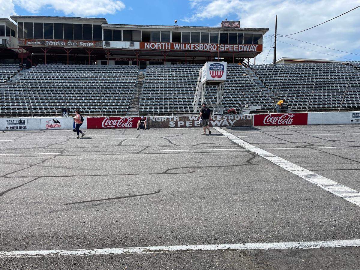 The calm before the storm: Fans on Tuesday afternoon roam around the North Wilkesboro Speedway track before the race on Wednesday, Aug. 31, 2022.