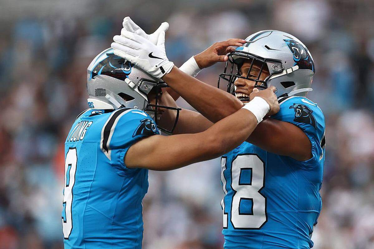 CHARLOTTE, NORTH CAROLINA - AUGUST 08: Quarterback Bryce Young #9 of the Carolina Panthers celebrates with teammate wide receiver Jalen Coker #18 following a touchdown in the first half of the NFL Preseason 2025 game at Bank of America Stadium on August 08, 2025 in Charlotte, North Carolina. (Photo by Jared C. Tilton/Getty Images)