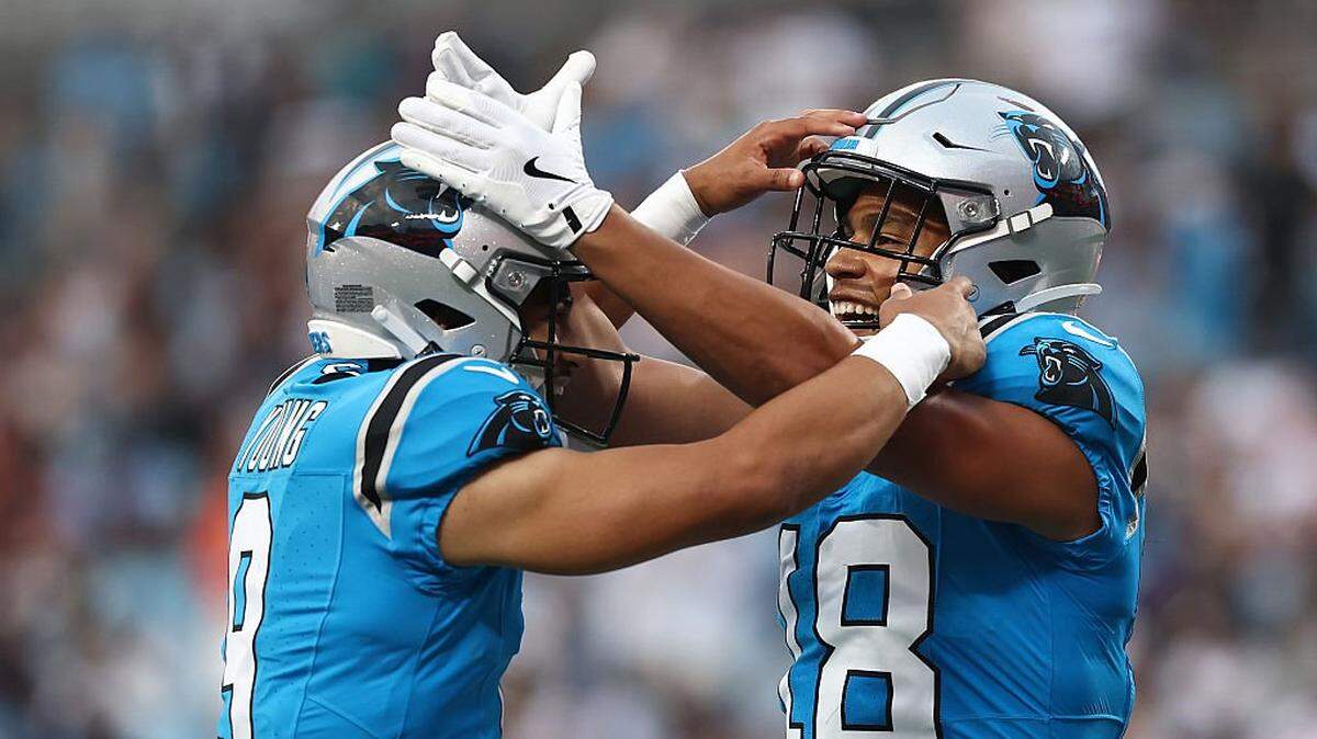 CHARLOTTE, NORTH CAROLINA - AUGUST 08: Quarterback Bryce Young #9 of the Carolina Panthers celebrates with teammate wide receiver Jalen Coker #18 following a touchdown in the first half of the NFL Preseason 2025 game at Bank of America Stadium on August 08, 2025 in Charlotte, North Carolina. (Photo by Jared C. Tilton/Getty Images)