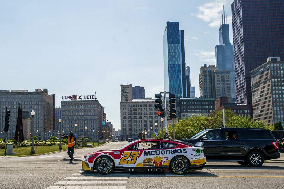 NASCAR driver Bubba Wallace drives through Grant Park on July 19, 2022, in Chicago. The city announced it will transform the Grant Park environs into the first-ever NASCAR street race for a weekend next summer. (Armando L. Sanchez/Chicago Tribune/TNS)