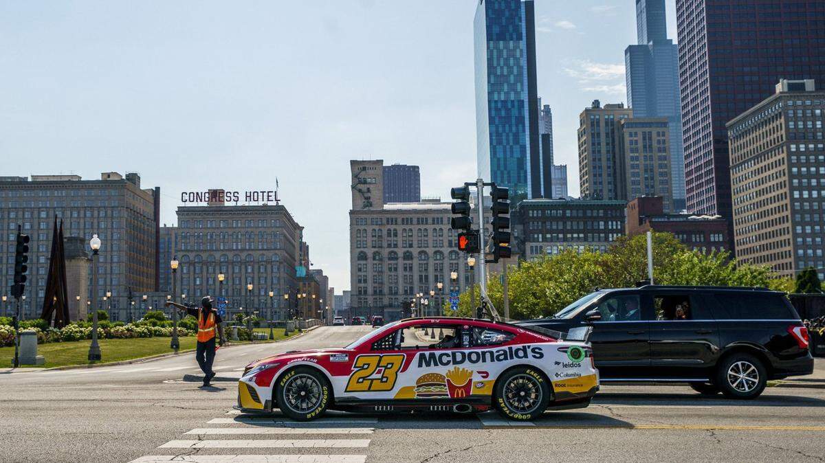 NASCAR driver Bubba Wallace drives through Grant Park on July 19, 2022, in Chicago. The city announced it will transform the Grant Park environs into the first-ever NASCAR street race for a weekend next summer. (Armando L. Sanchez/Chicago Tribune/TNS)