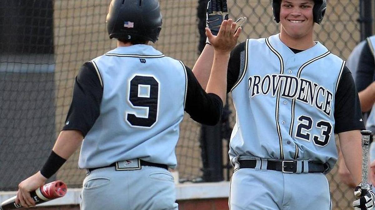 Providence designated hitter Mason Ingle, right, congratulates Brennon Welsh after Welsh scored against Ardrey Kell during a SoMeck 8 baseball game last week. Providence, the reigning 4A state champion, is 11-0 and ranked as high as No. 4 in national high school polls.