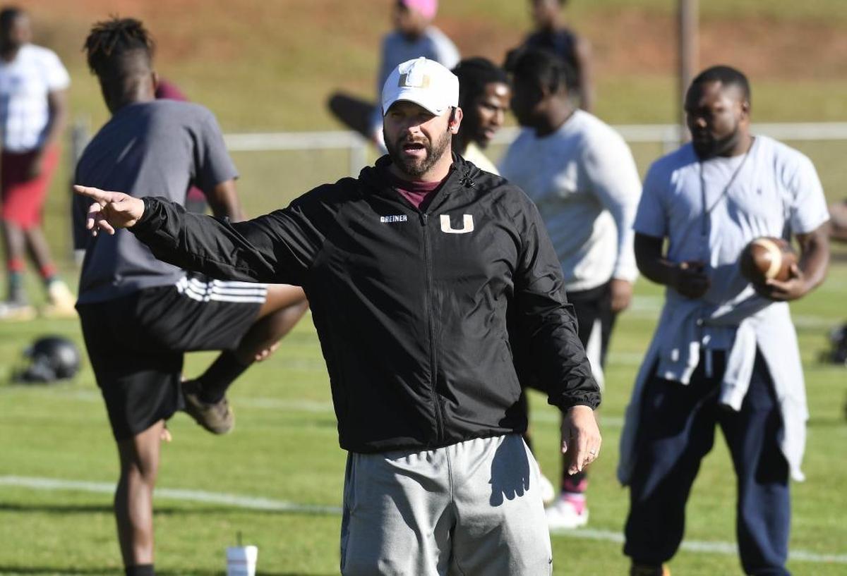 Harding High football coach Sam Greiner makes a point during Thursday’s football practice at the school.