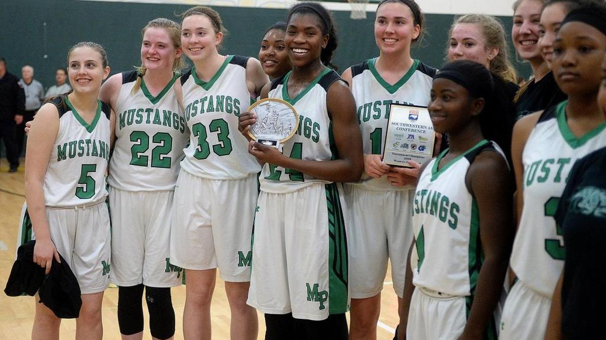Myers Park players celebrate their win in the Southwestern 4A championship game at Independence.