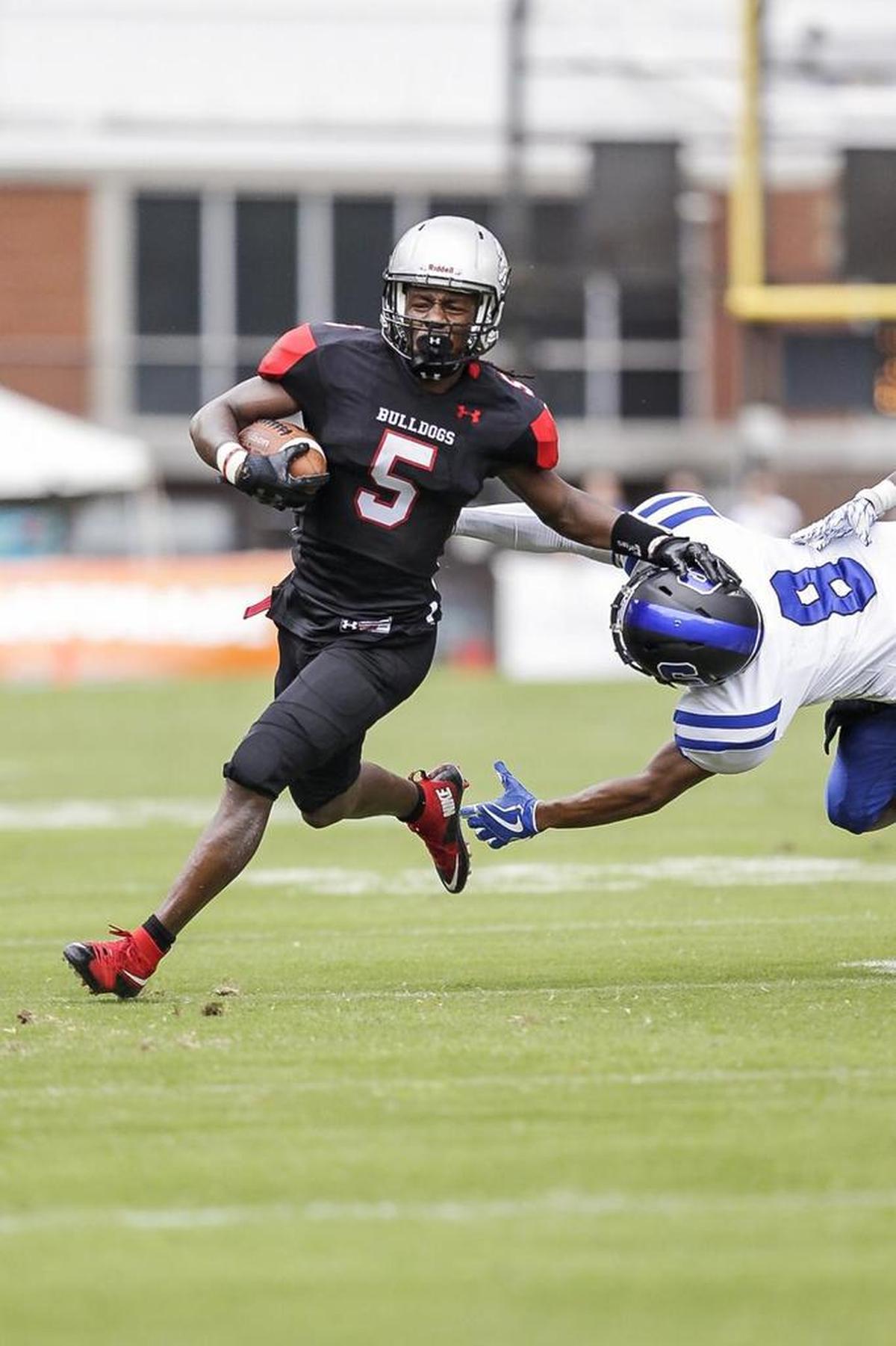 Butler Bulldog running back Keyon Lesane runs for a first down during Saturday’s game against Scotland County at Memorial Stadium.