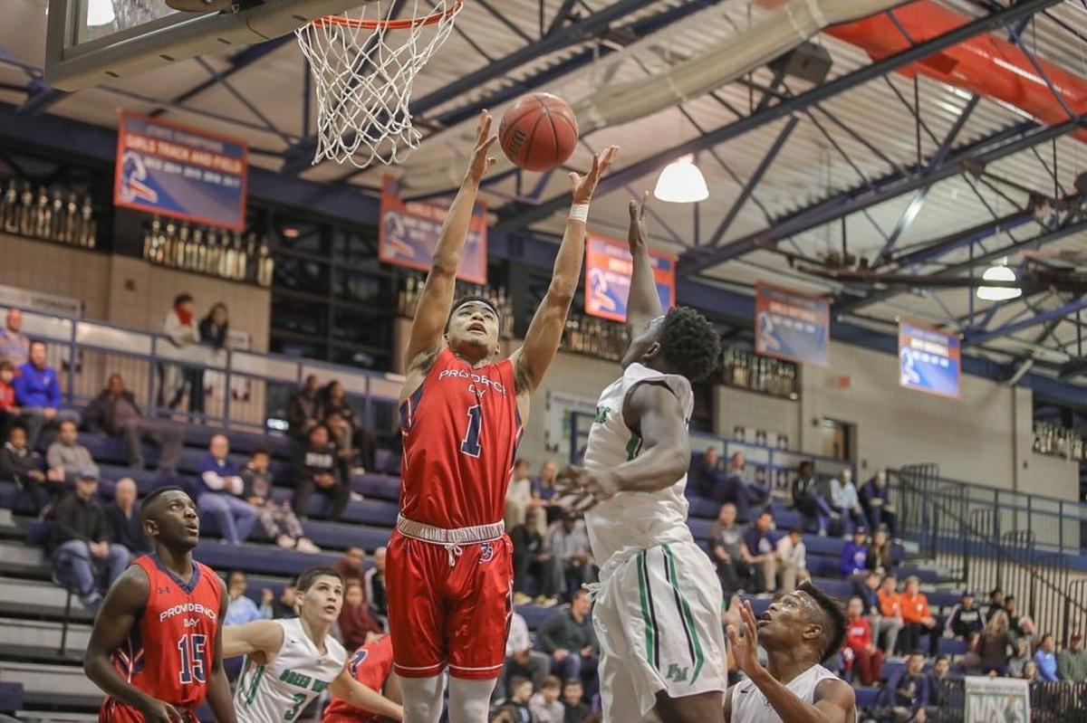 Providence Day's Devon Dotson grabs a key rebound during late first half action. Providence Day would play Fort Myers at the 2017 Hoodie's House High School Hoops Classic December 27, 2017.