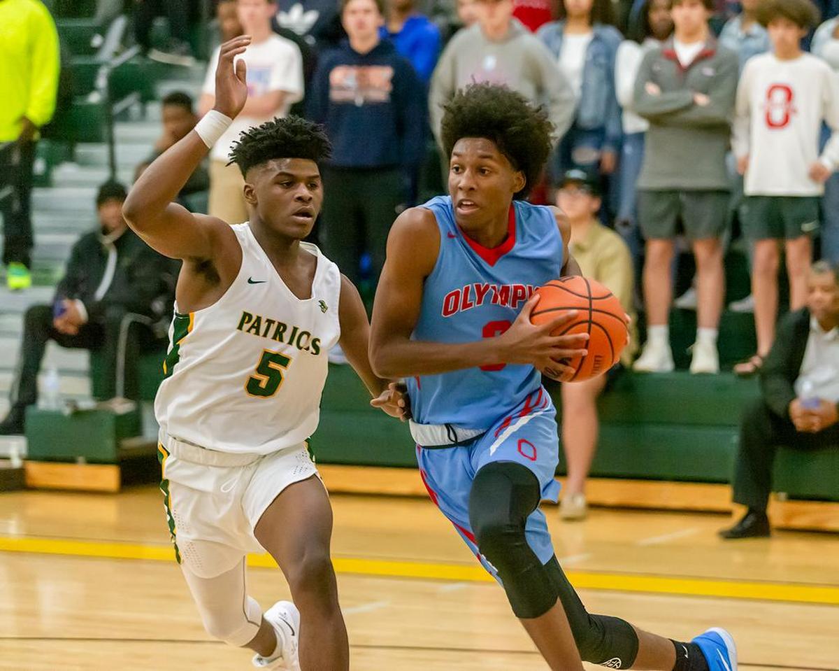 Olympic’s Josh Banks drives to the basket.