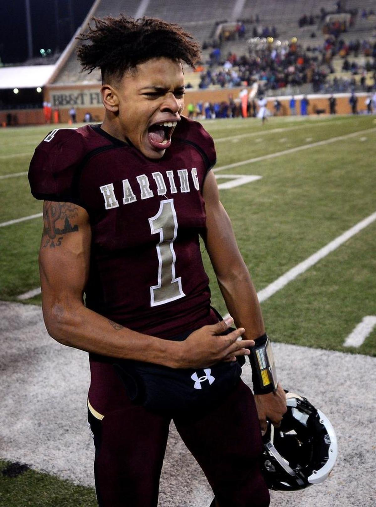Harding University quarterback Braheam Murphy celebrates his 95-yard touchdown against Scotland County on the team's sideline during fourth quarter action in the NCHSAA 4A State Championship game at BB&T Field in Winston-Salem, NC on Saturday, December 9, 2017. Harding defeated Scotland County 30-22.