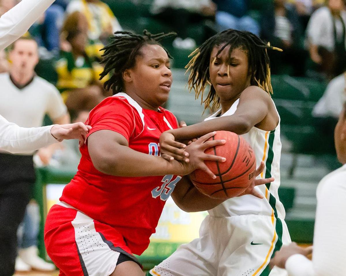 An Independence player and an Olympic player battle for the ball Tuesday.