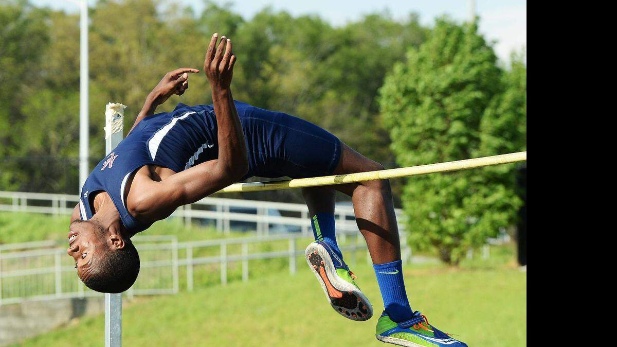 
Mallard Creek's Keon Howe attempts to clear the bar at 6' 8" while competing in the high jump during the MECKA 4A track championships Wednesday at Mallard Creek High School.


