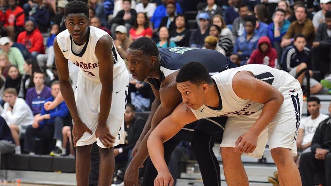 Providence Day’s Trey Wertz (left) with High Point Christian’s Bam Adebayo and Providence Day’s Grant Williams during a free throw at the Charlotte Hoops Challenge at Myers Park.