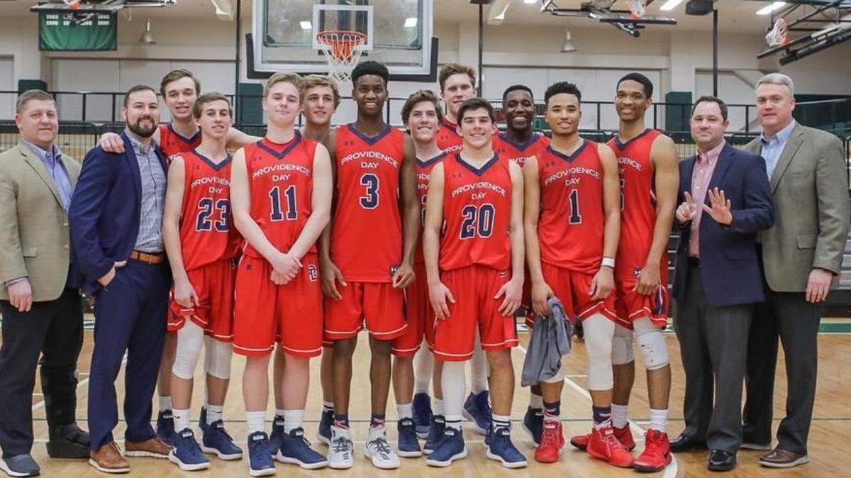Providence Day’s basketball team poses after winning its sixth straight CISAA conference title Friday night. The Chargers beat Charlotte Country Day.