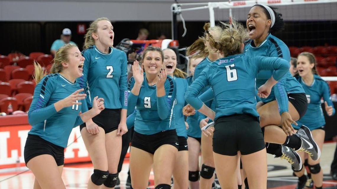 Cox Mill celebrates after winning the match point. The Chapel Hill Tigers played the Cox Mill Chargers for the NCHSAA 3A volleyball championship that took place at the N.C. State Reynolds Coliseum in Raleigh, N.C. on Saturday, November 5, 2016. Cox Mill won 3-0.