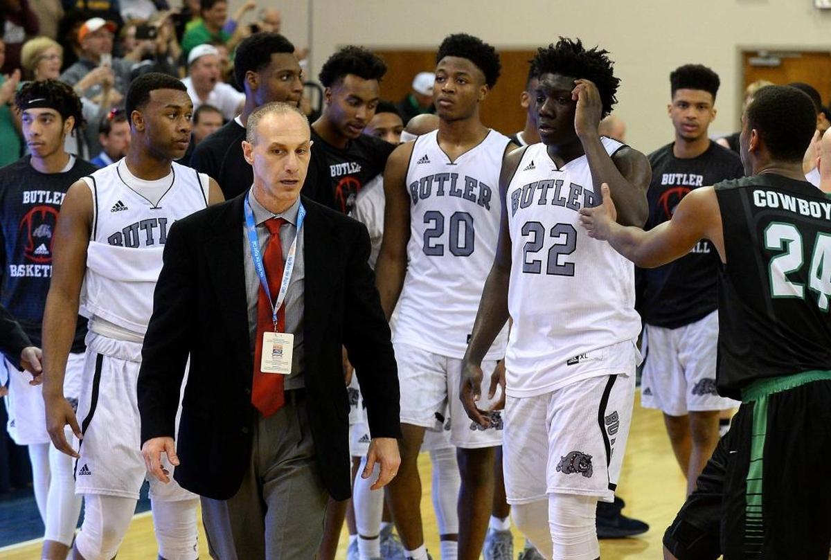After a last-second shot beat them in the N.C. 4A regional finals, Butler’s players walk back to their bench dejected following a 61-58 loss to Southwest Guilford in the N.C. 4A Western Regional Championship in March.