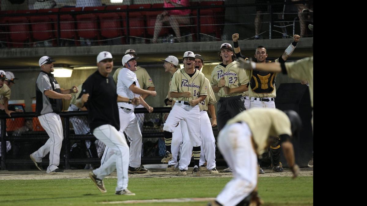 
Providence celebrates a run Saturday in Game 3 of the N.C. 4A title game. Providence rolled to a 10-0 win over Millbrook in Game 2, then cruised Saturday night to a 10-2 victory in Game 3 to take the series 2-1 and win the state championship.


