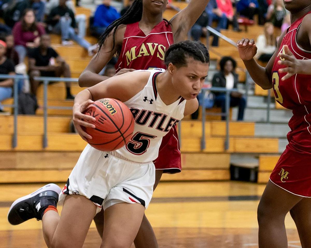 Butler’s Hailey Nance (5) drives the baseline and is fouled in a game with Mallard Creek Thursday.