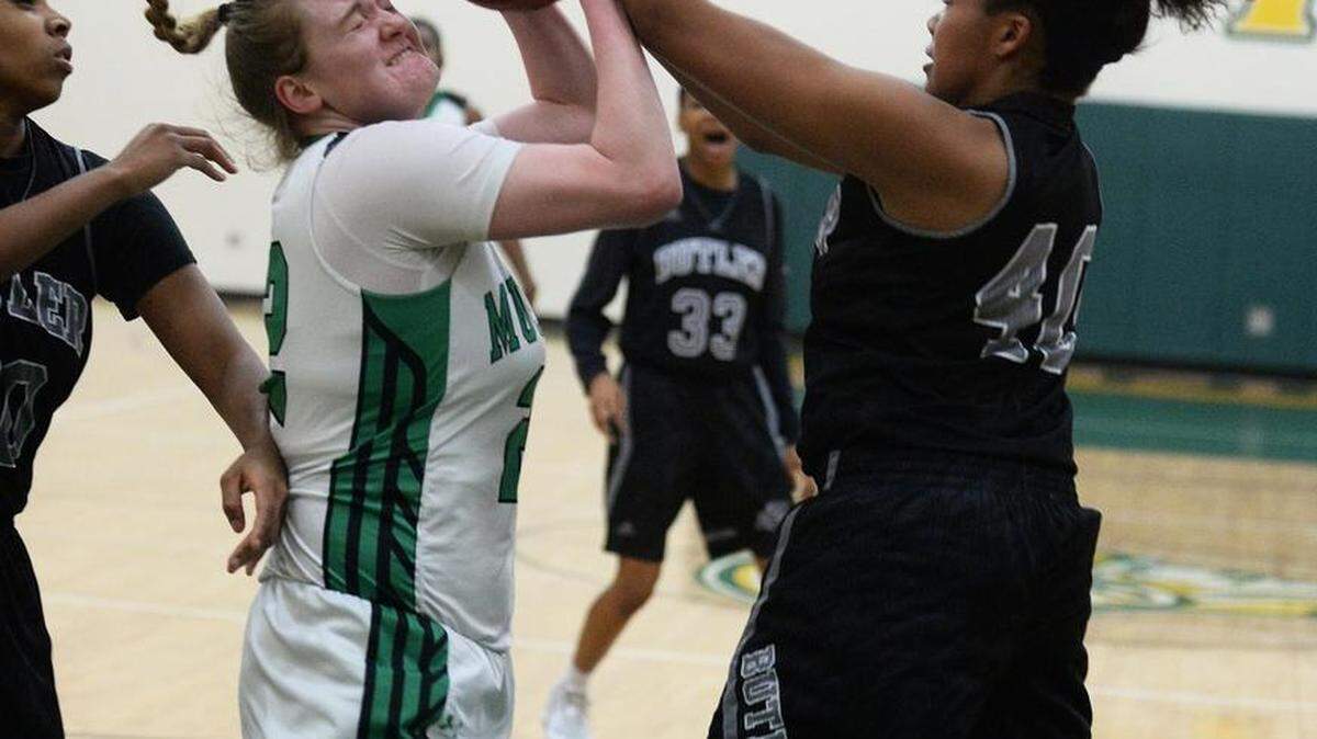 Myers Park #22 Caroline Owens has her shot blocked by Butler #40 Tia Thompson during Friday's girls Southwestern 4A championship games at Independence.