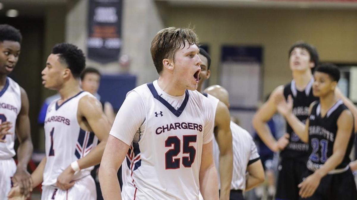 Providence Day's John Miralia (25) celebrates the Chargers’ emotional rally at home against Charlotte Christian in the NCISAA 3A quarterfinals.