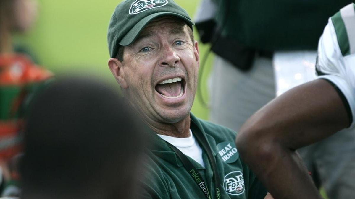 Dutch Fork head football coach Tom Knotts talks with his players while they take on Irmo at Irmo High School. Columbia, S.C.08-18-2010. C. Aluka Berry - The State Media Company\caberry@thestate.com