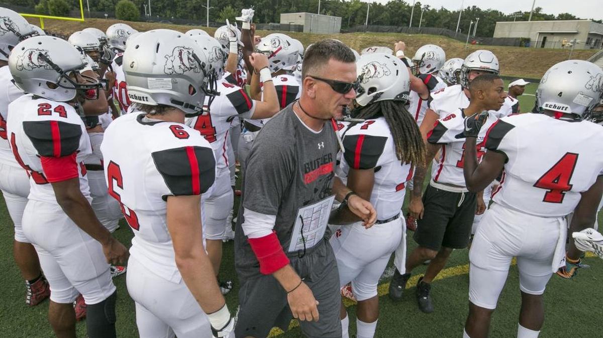 Butler head coach Brian Hales has led his team to an NCHSAA state championship. All are played outside of Charlotte. New Panthers owner David Tepper wants to change that.