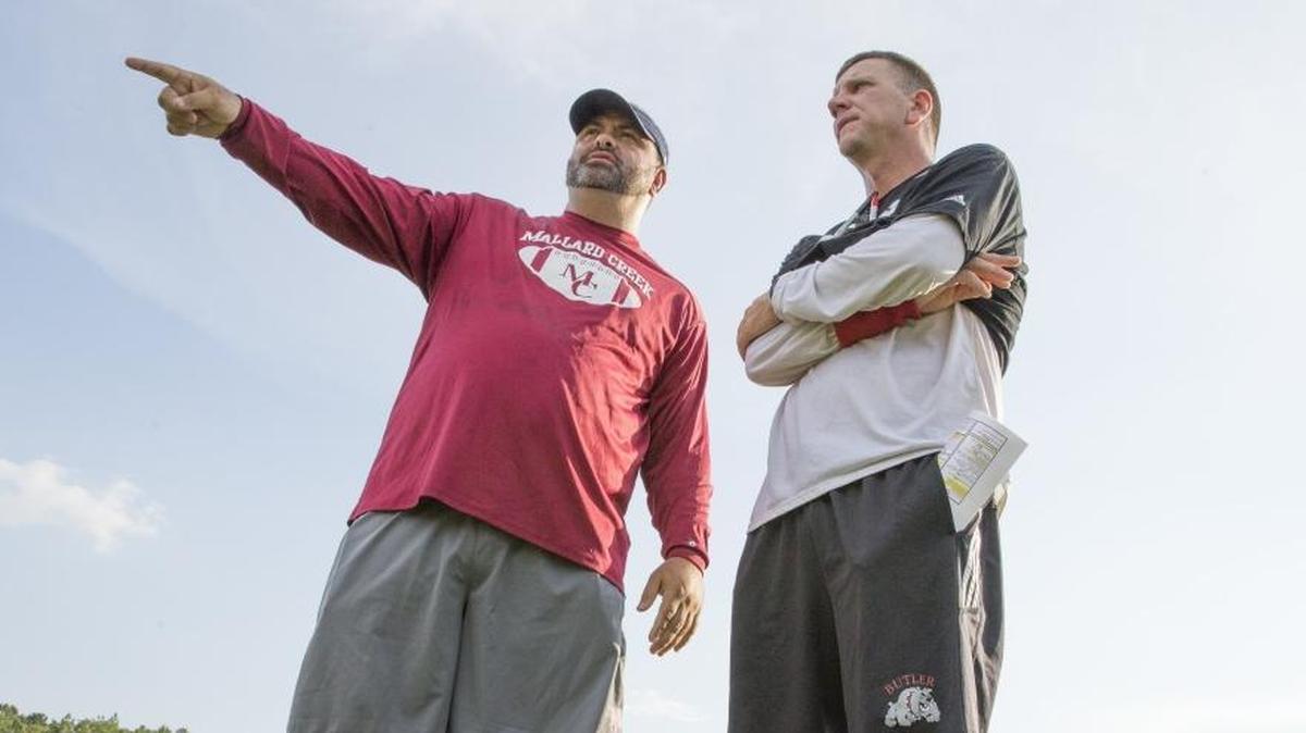 Mallard Creek head coach Mike Palmieri, left, and Butler coach Brian Hales will see their teams face off in a highly anticipated game Friday