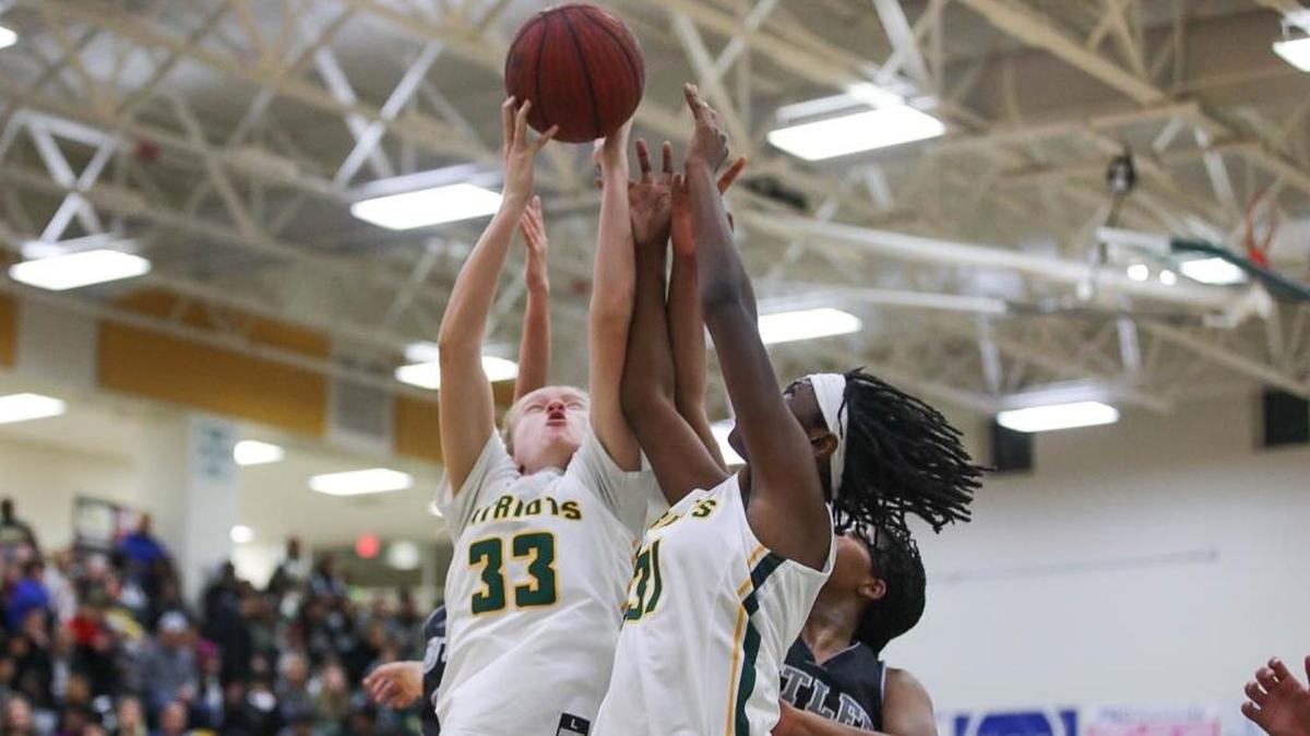 Independence players Laura Flynn (33) and Ayanna Anderson (31) battle for a rebound off a missed Butler field goal attempt. Independence would host Butler Friday night December 14, 2017.