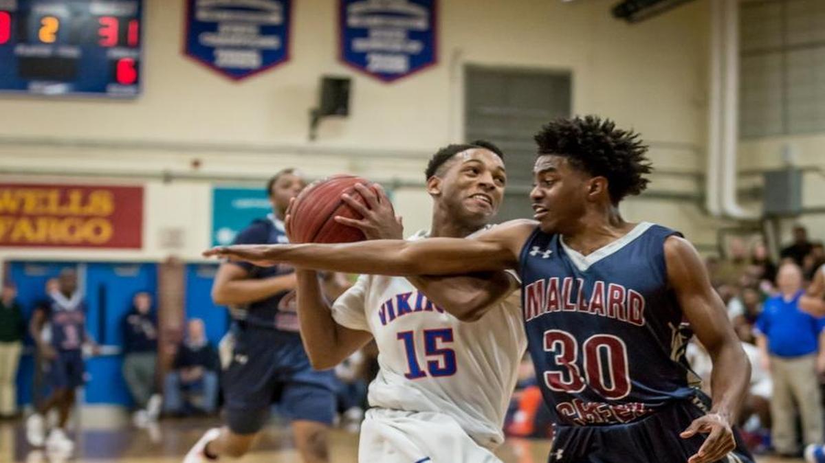 Eric Reed of Mallard Creek attempts to steal the ball from North Meck's Jaylen Lowery as the Mallard Creek Mavericks would play North Meck for the Conference Championship