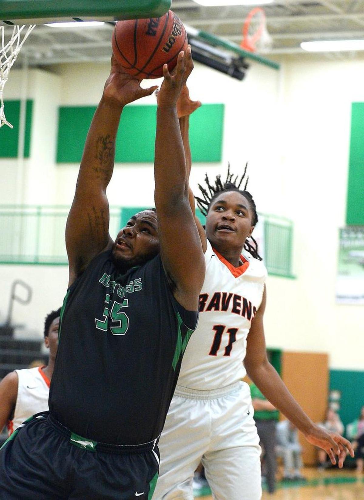 All-conference basketball player Raquan Brown, right, is transferring to a new Mecklenburg County School