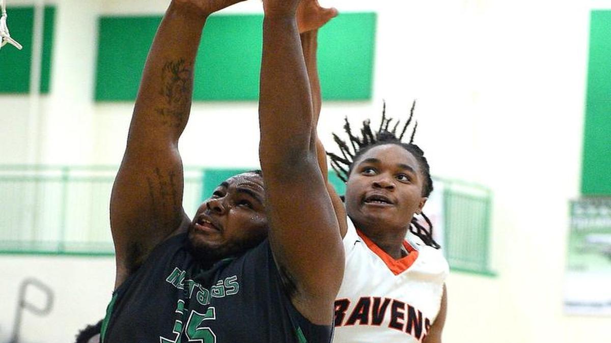 All-conference basketball player Raquan Brown, right, is transferring to a new Mecklenburg County School