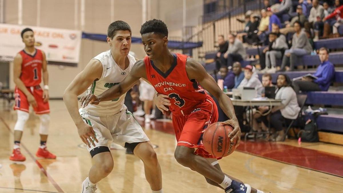 Guard Trey Wertz of Providence Day takes on a Fort Myers (Fla.) defender during early 2nd half action. Providence Day beat Fort Myers in the opening round of the Hoodie’s House Tournament at Providence Day