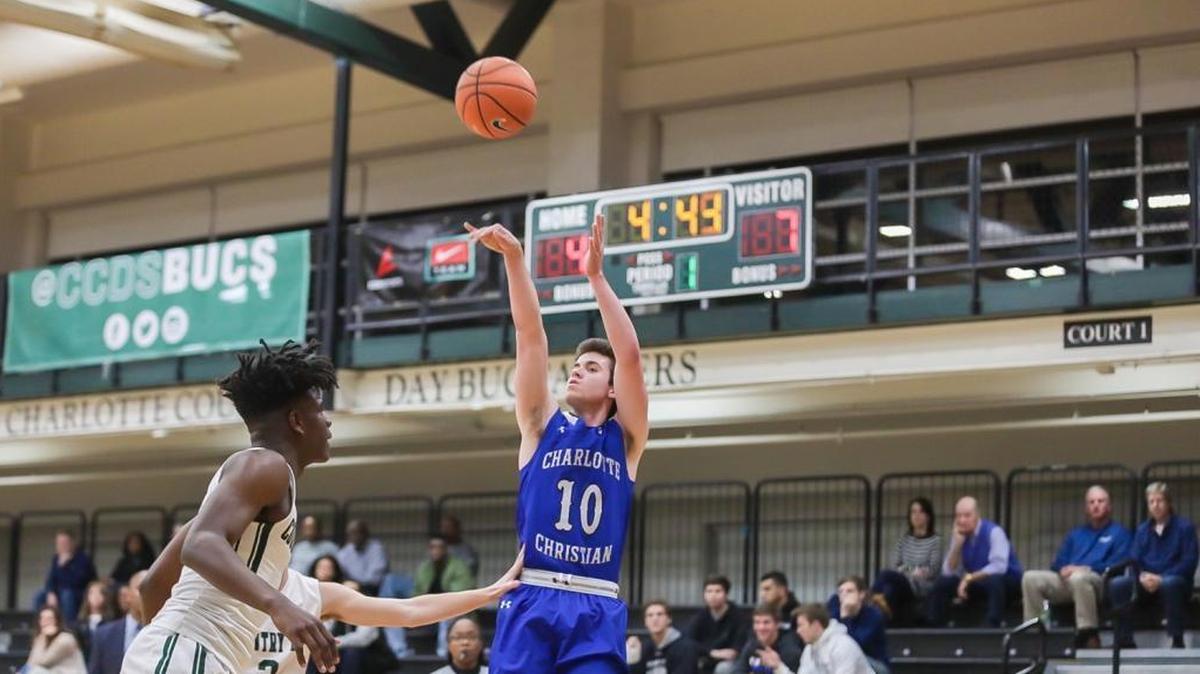 J.C. Tharrington (10) of Charlotte Christian pulls up and knocks down a three point shot mid way through the 1st quarter. Charlotte Country Day would host Charlotte Christian January 9, 2018.