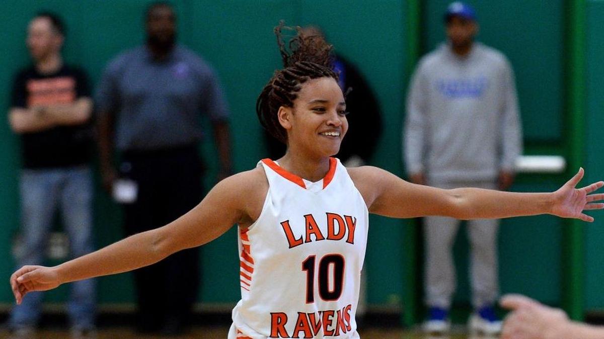Rocky River's Shakeila Carter smiles as she runs to the team's bench celebrating the team's play against the Butler Bulldogs during the Southwestern 4A championship game action at Myers Park High School on Friday, February 17, 2017. Rocky River defeated Butler 56-34.