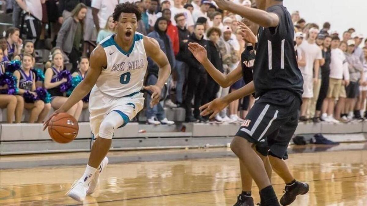Cox Mill High star Wendell Moore, who led his team to a state championship Saturday, predicts the NCAA Final Four for the Charlotte Observer.