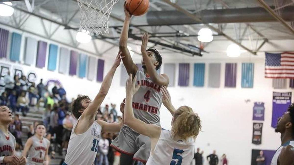 London England of Lincoln Charter shoots over two Cox Mill defenders. Both teams are ranked in multiple statewide media polls this week