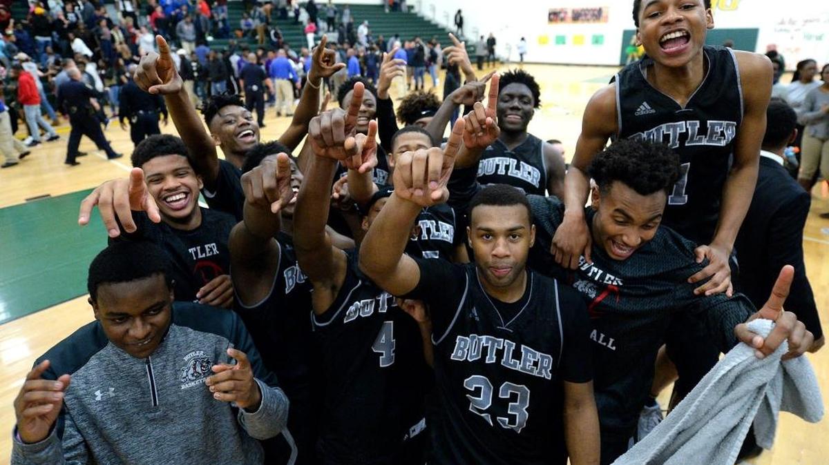 The Butler Bulldogs celebrate their victory over the Independence Patriots at Independence High on Friday, February 10, 2017. Butler defeated Independence 52-48 to win the Southwestern 4A Championship.