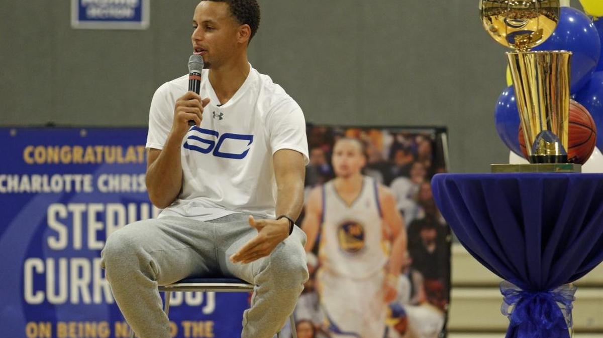 CHARLOTTE, NC - SEPTEMBER 18: Stephen Curry #30 of the Golden State Warriors returns to his high school with the Larry O'Brien Championship Trophy on September 18, 2015 at Charlotte Christian High School in Charlotte, North Carolina. NOTE TO USER: User expressly acknowledges and agrees that, by downloading and or using this photograph, User is consenting to the terms and conditions of the Getty Images License Agreement. Mandatory Copyright Notice: Copyright 2015 NBAE (Photo by Bob Leverone/NBAE via Getty Images)